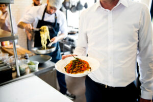 Chef and Waiter working in Kitchen