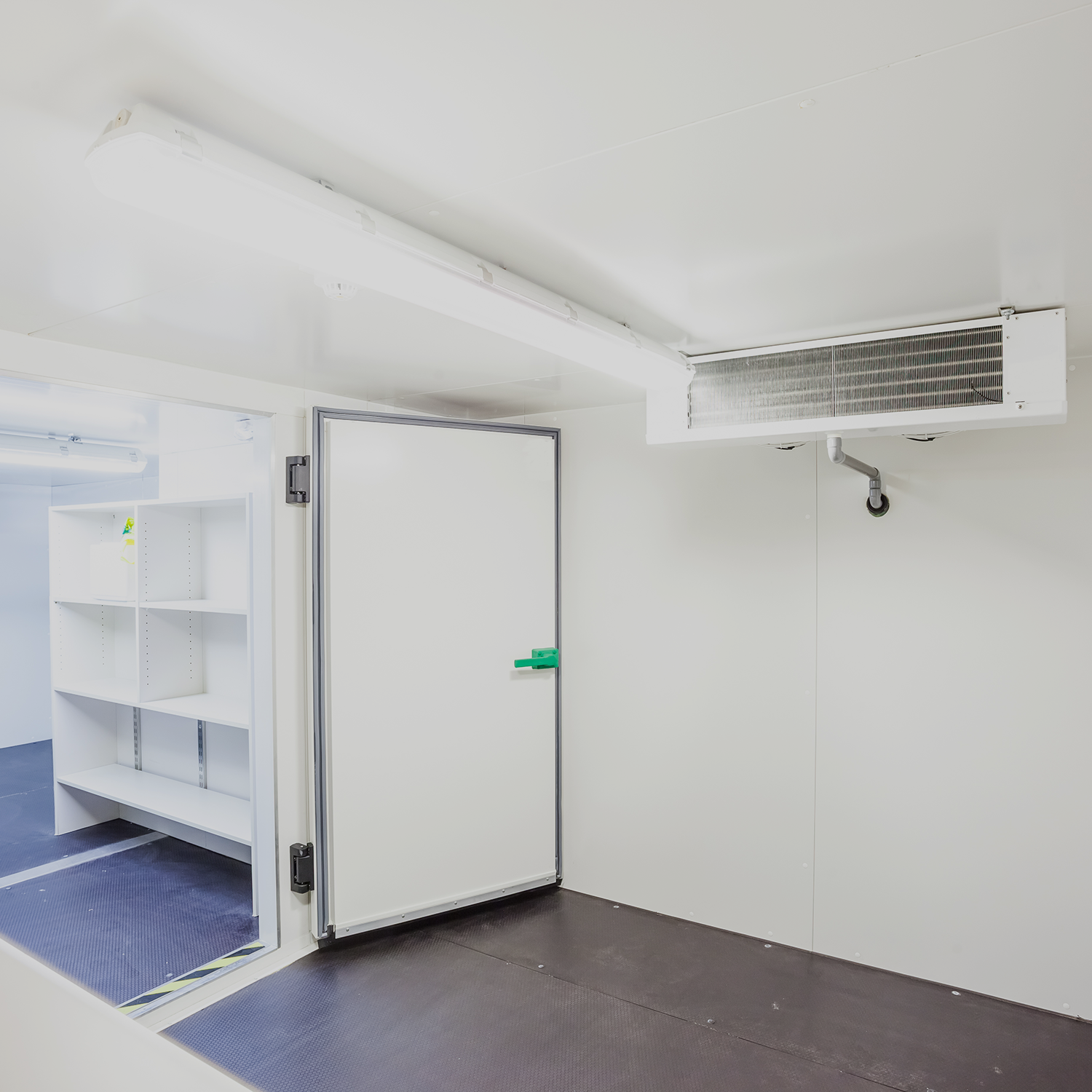 Interior of cold room with cold room door and refrigeration